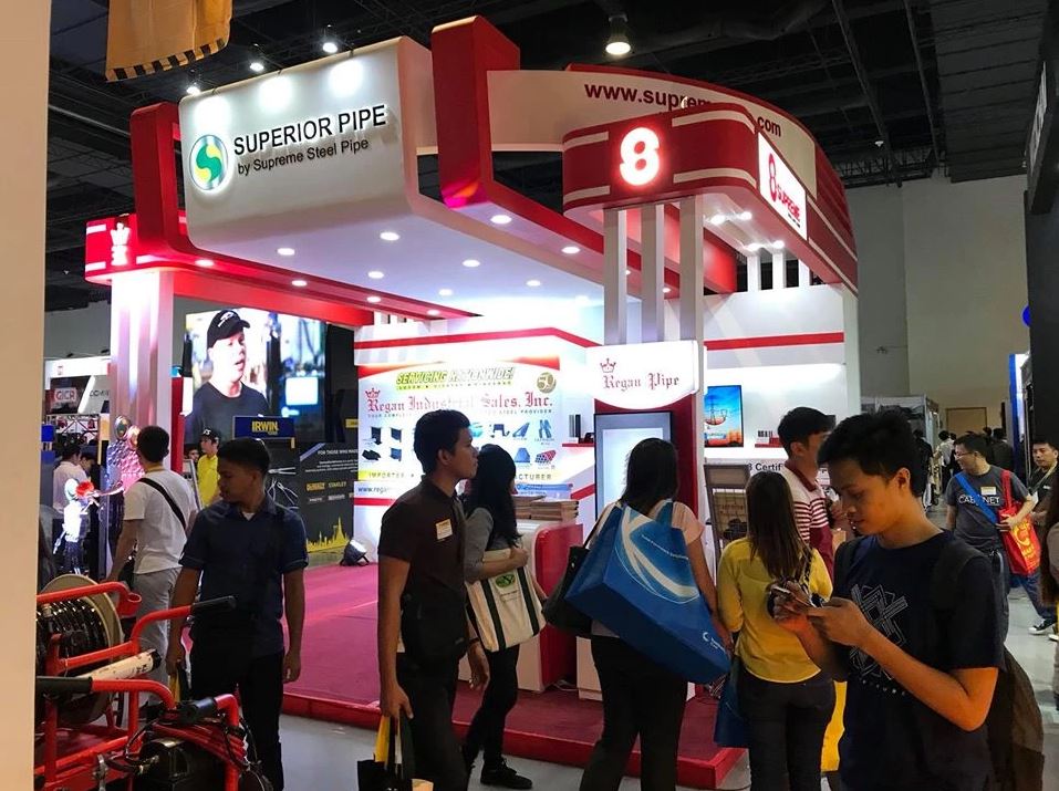 Supreme, Superior Pipe and Regan exhibition booth with people