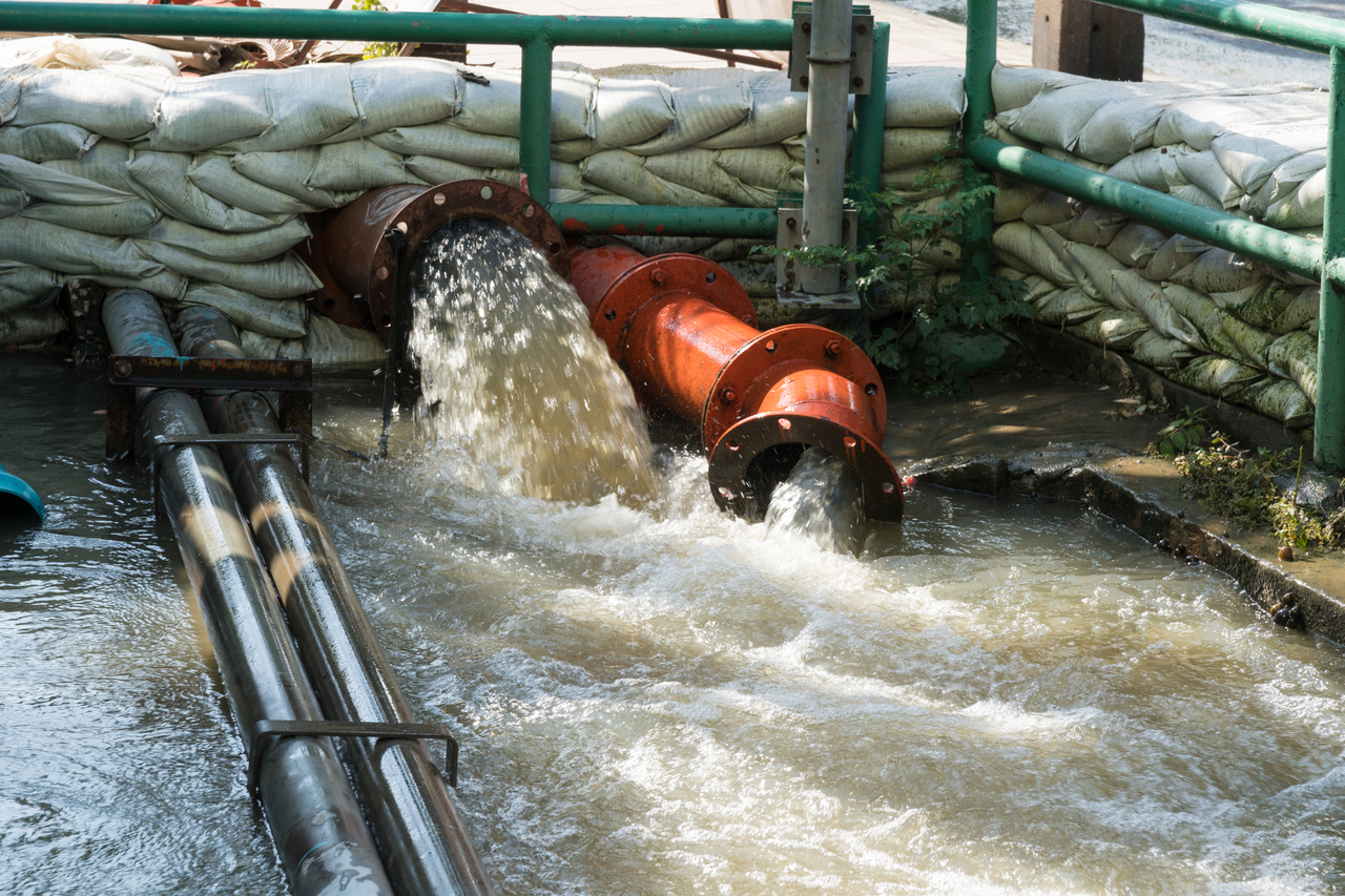 A GI waste water pipe releasing water