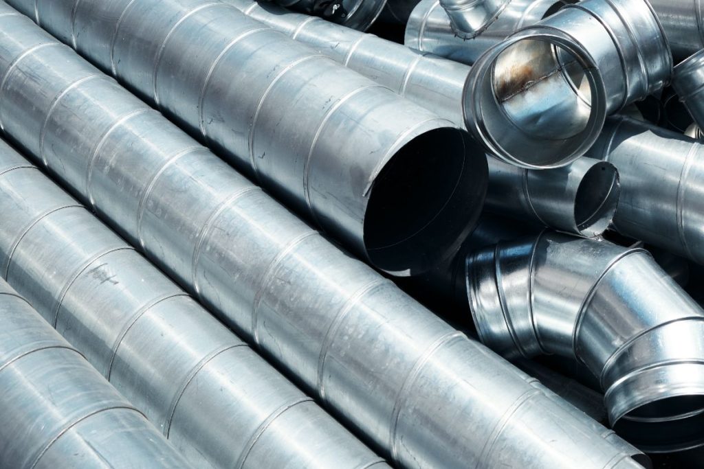 Galvanized metal duct pipes and fittings for industrial piping applications