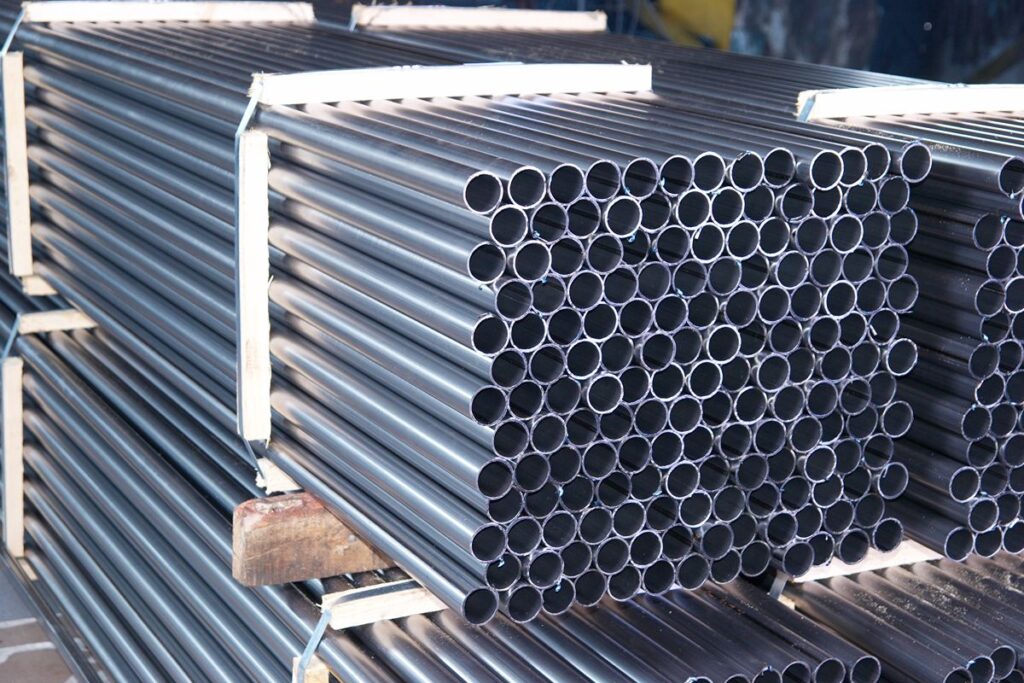 Bundled steel pipes stored for construction use, highlighting their structural strength and dimensional consistency.