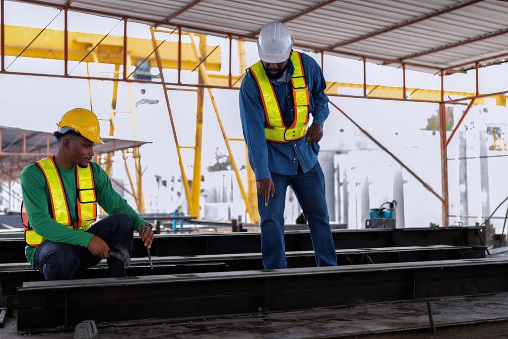 Construction workers inspect steel materials at an active project site in the Philippines