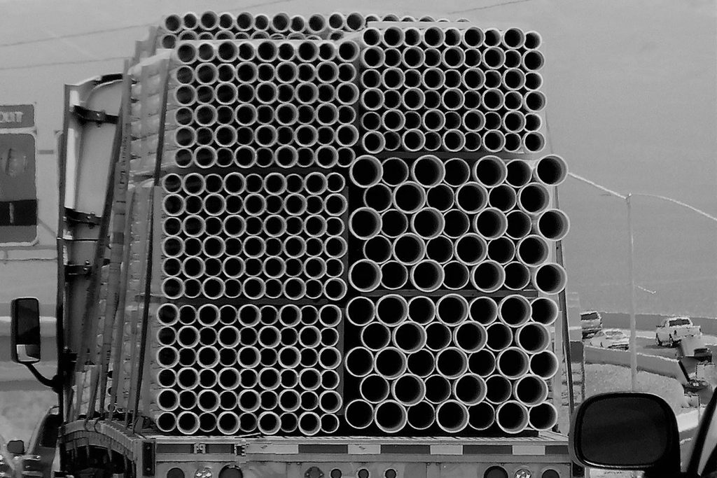 Truck loaded with bundled GI pipes for project delivery within Metro Manila, nearby provinces, or nationwide locations